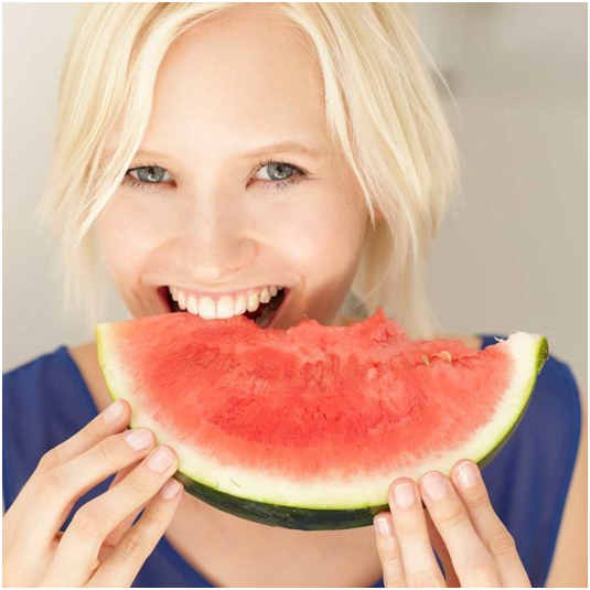 Woman eating watermelon